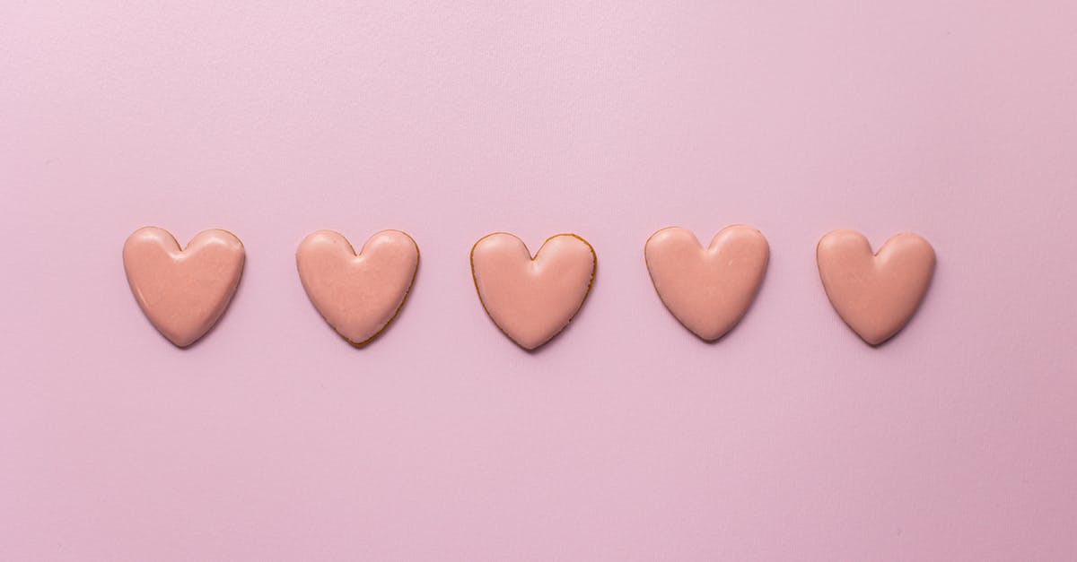 What is the difference between Encounters and Events? - Top view of various handmade small cookies in heart shape placed on pink background next to each other