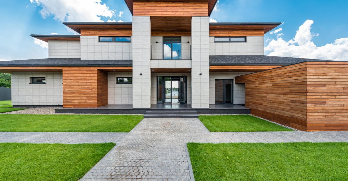 What is the jizo in the main courtyard for? - Contemporary villa against cloudy blue sky