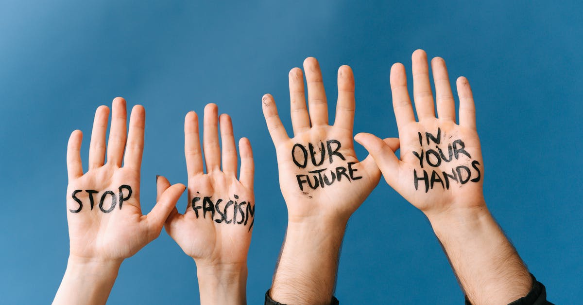 What is the meaning of this message? - Hands with Message Stop Fascism Our Future in Your Hands