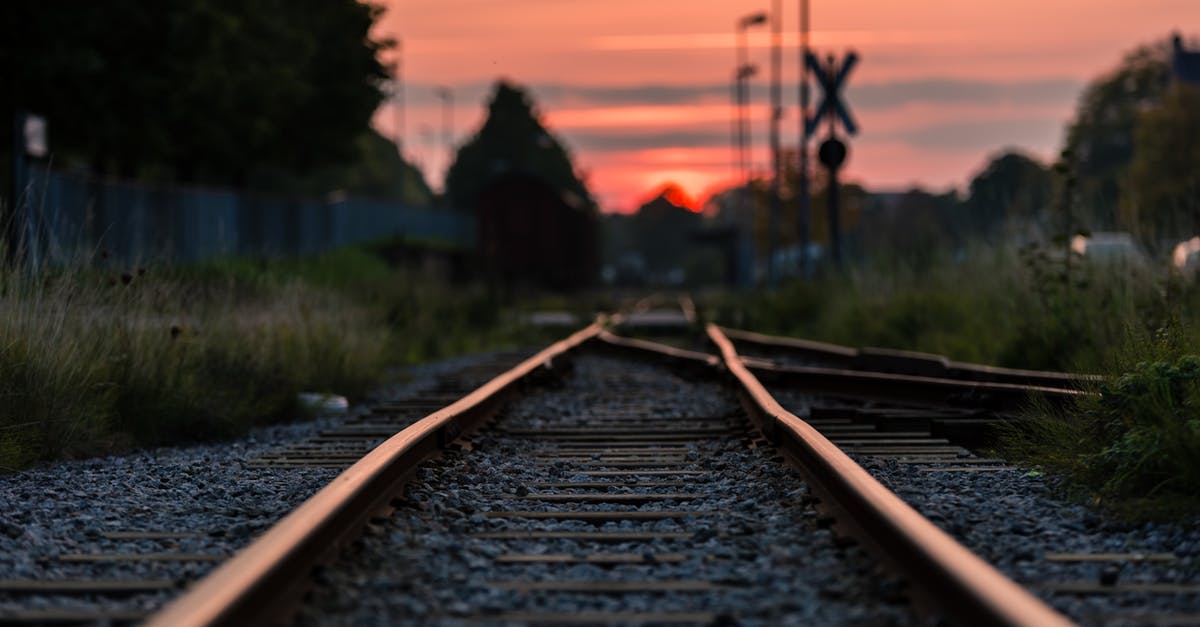 What is the most efficient rail layout? - Shallow Focus Photography of Railway during Sunset