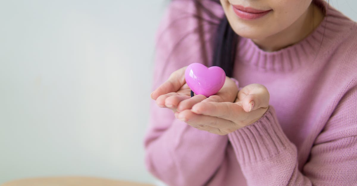 What is the upside to Purple Heart - Woman in Purple Sweater Holding a Toy Heart