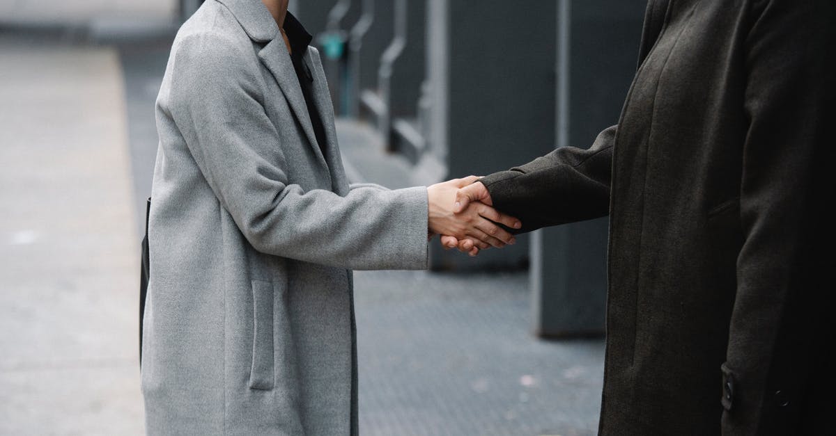 What is this downtown side job during the Corpo prologue? - Crop anonymous man and woman in elegant coats shaking hands on street while having meeting in city downtown What is this downtown side job during the Corpo prologue? - Crop anonymous man and woman in elegant coats shaking hands on street while having meeting in city downtown