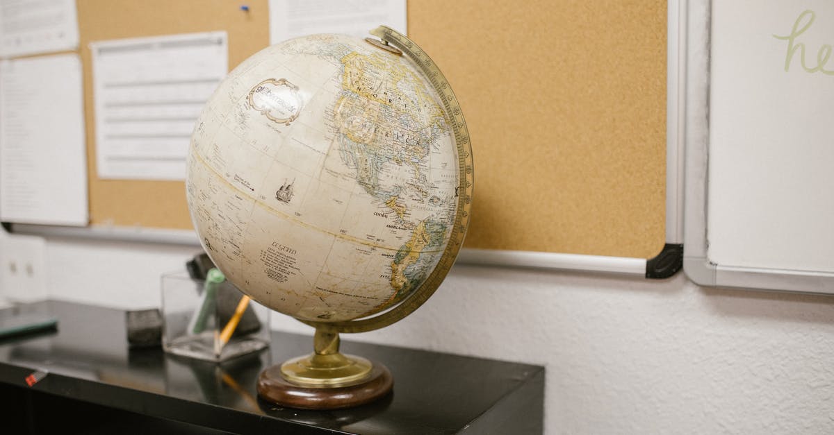 What is this orb? - White and Gold Desk Globe on Black Table