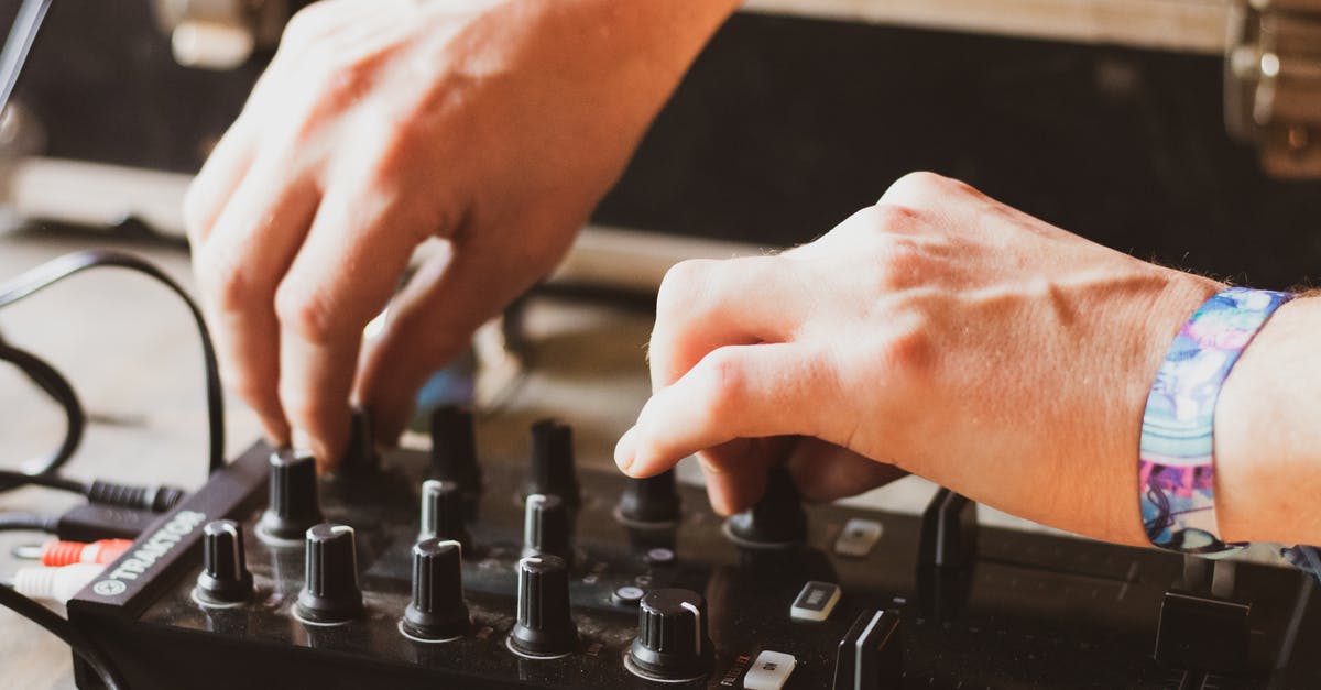 What mechanics control the path emblems on the player cards? - Dj making tune with musical equipment