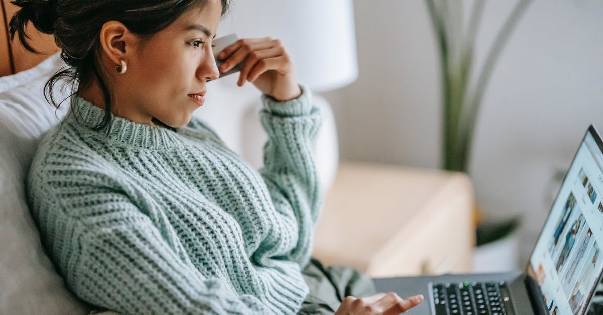 What modifications should I buy for my Vigilance Guardian? - Side view of crop concentrated young ethnic female using touchpad of netbook and shopping online