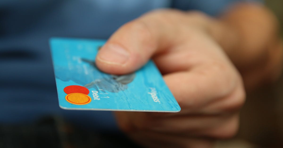 What modifications should I buy for my Vigilance Guardian? - Person Holding Debit Card