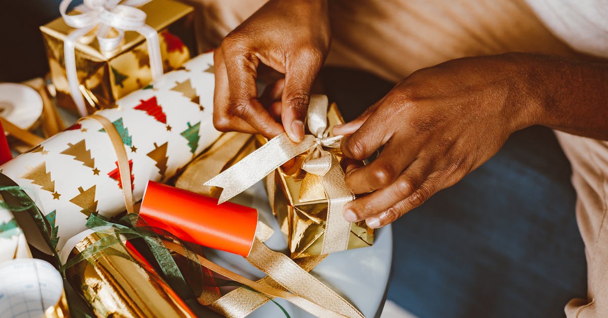 What powers do the ribbons possess? - Person Holding Red and White Gift Box