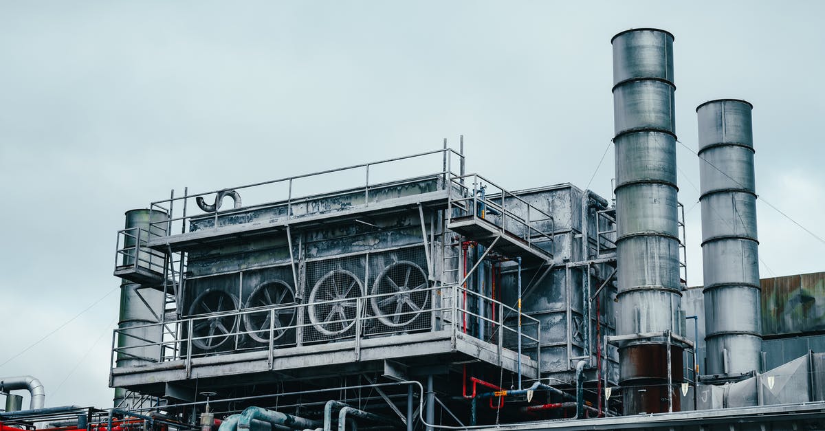 What resources are (technically) finite in Minecraft? - Exterior view of large industrial construction with metal tubes located on factory in daytime on cloudy weather