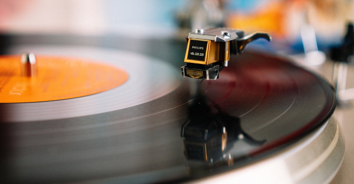 What songs is Lucio playing? - Retro turntable playing vinyl disc in living room