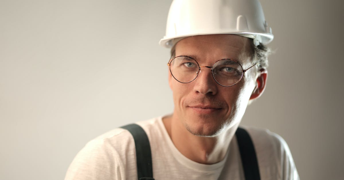 What the requirements for the greyed-out skills/perks? - Content male builder in workwear and hardhat smiling on gray background in studio and looking at camera