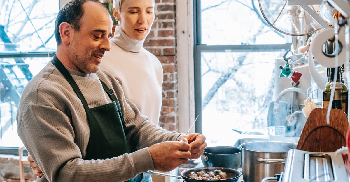 What to do about Steam window/taskbar icon not showing up after a reboot? - Smiling man in apron cooking against attentive girlfriend and gas stove with meatballs in pan at home What to do about Steam window/taskbar icon not showing up after a reboot? - Smiling man in apron cooking against attentive girlfriend and gas stove with meatballs in pan at home