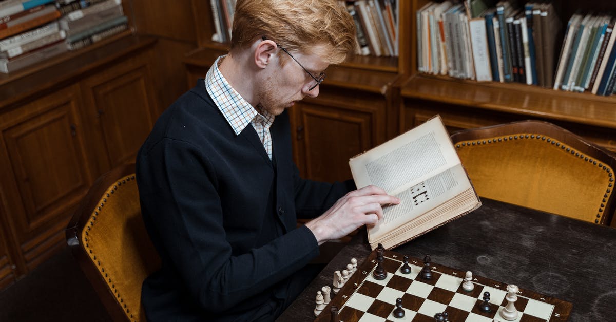 When do the books and the games diverge? - A Man Reading a Book Inside the Library