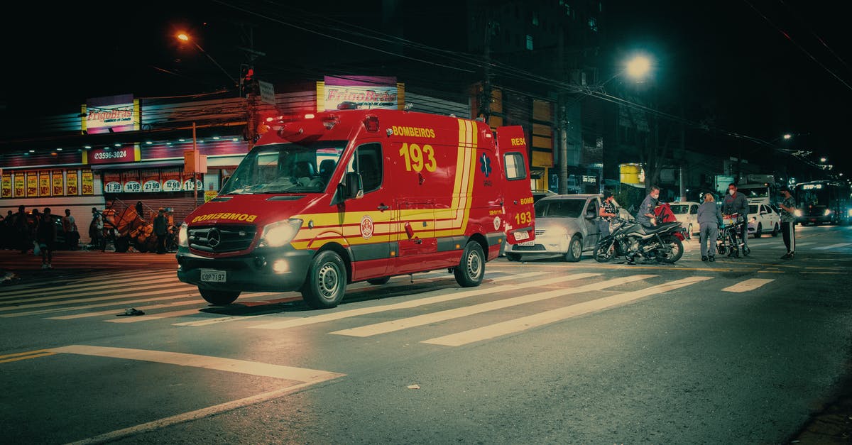 When exactly does the auto-save save the game in Dark Souls? - Red emergency transport near  car crash on illuminated night street in modern city