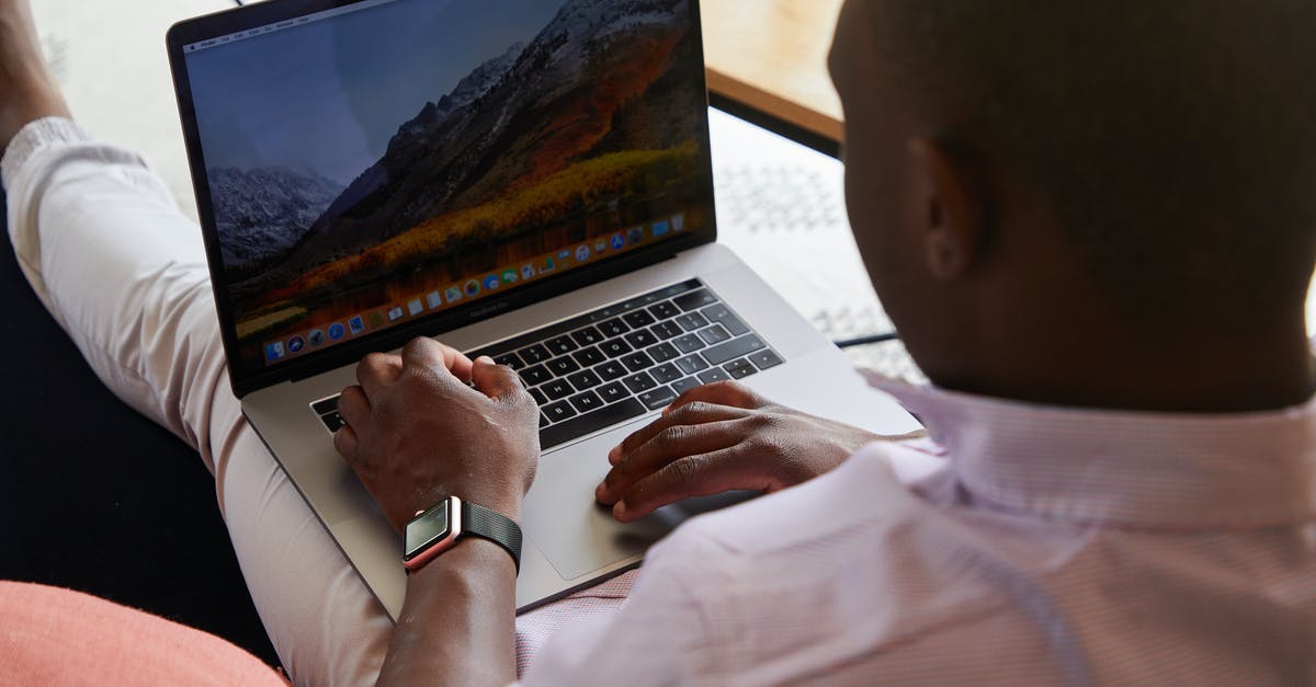 When I enter the Institute for the first time I can't progress - Black man with smart watch using touchpad of laptop When I enter the Institute for the first time I can't progress - Black man with smart watch using touchpad of laptop