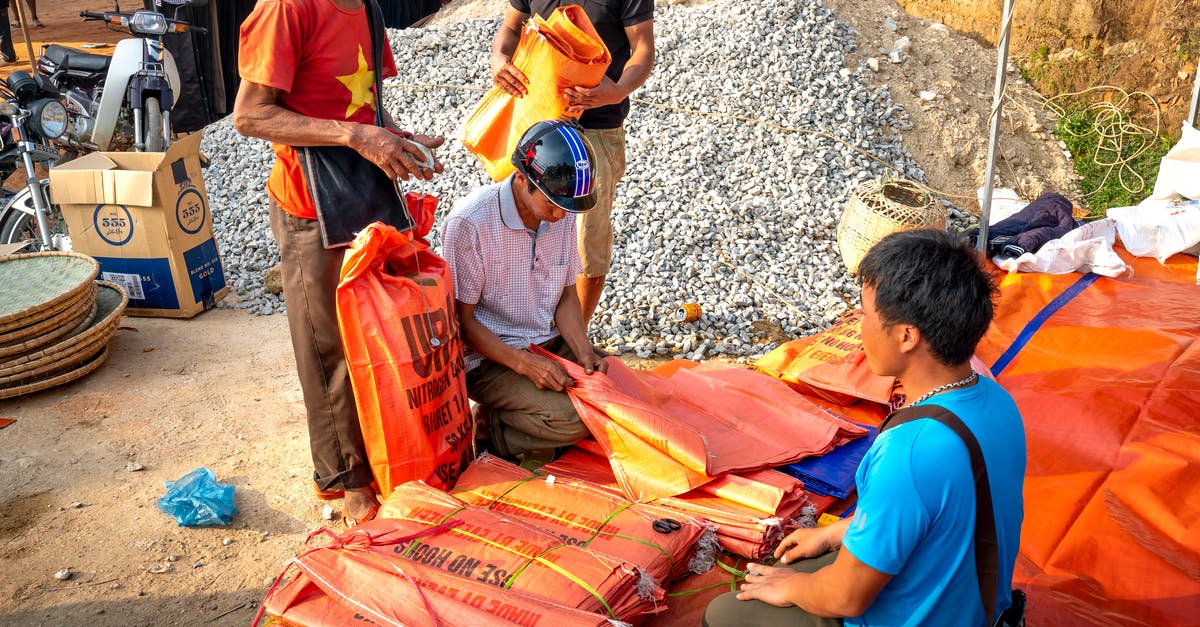 When Summoning Custom Villager, Can you trade enchanted gear? [duplicate] - Asian men buying plastic bags in local street market