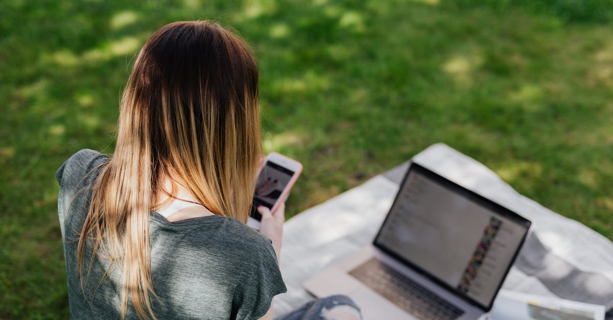 Where's the NPC that gives a free Surf-wielding Pokemon if you don't have one somehow? - From above back view of skinny long haired teenage girl in casual clothes browsing social media on smartphone while spending time in sunny park during summer vacation