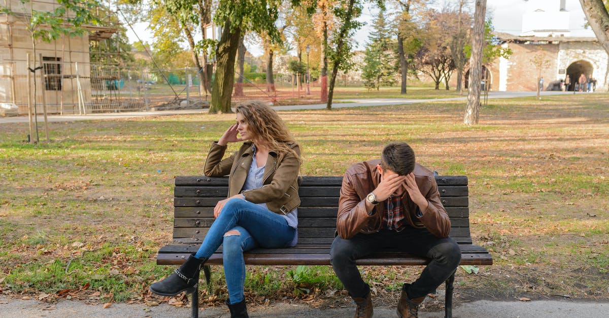 Where does Demise expect me to fight him? - Woman And Man Sitting on Brown Wooden Bench