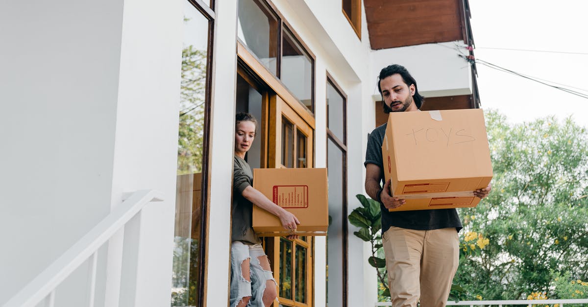 Where is the best place to find loads of dervish slimes? - Couple carrying carton boxes while moving out of old home