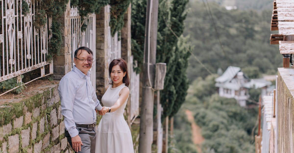 Where is the utilities menu? - Man in White Dress Shirt Hugging Woman in White Dress