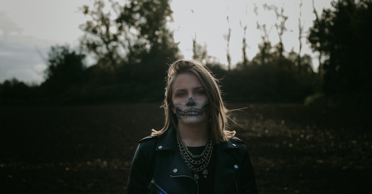 Which characters are unique to which version? - Young woman with skull makeup in meadow