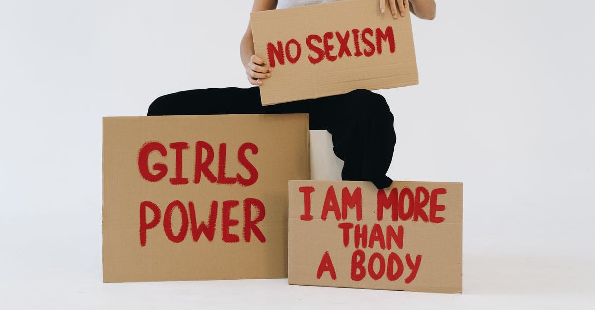 Which HM is more powerful? - A Woman Showing Three Placards