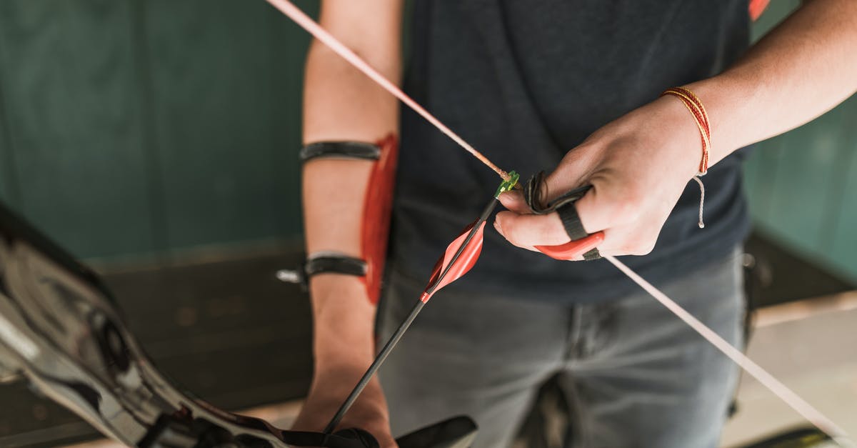 Which is the better archer? - Man Holding a Recurve Bow