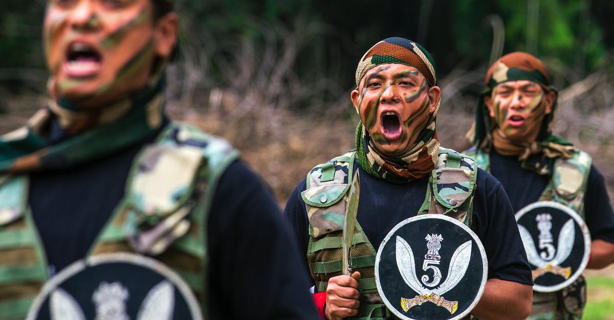 Which weapon is most effective with the Assault Shield ability? - Man in Green and Brown Camouflage Uniform