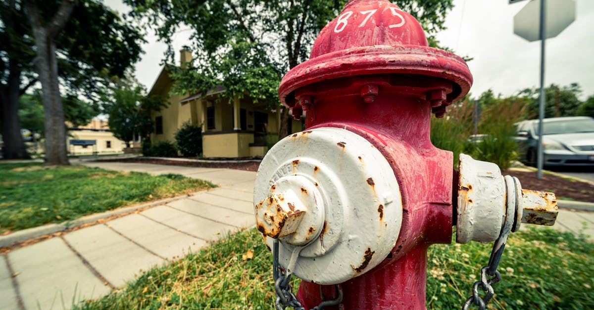 Why are the hidden items in Fire Red/Leaf Green sometimes absent? - Old rusty hydrant on grass meadow near house