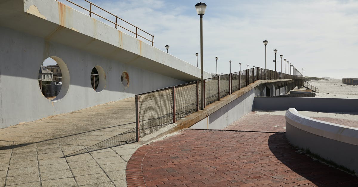 Why are there lots of empty tiles in the city centre? - Pier with concrete tile and streetlights