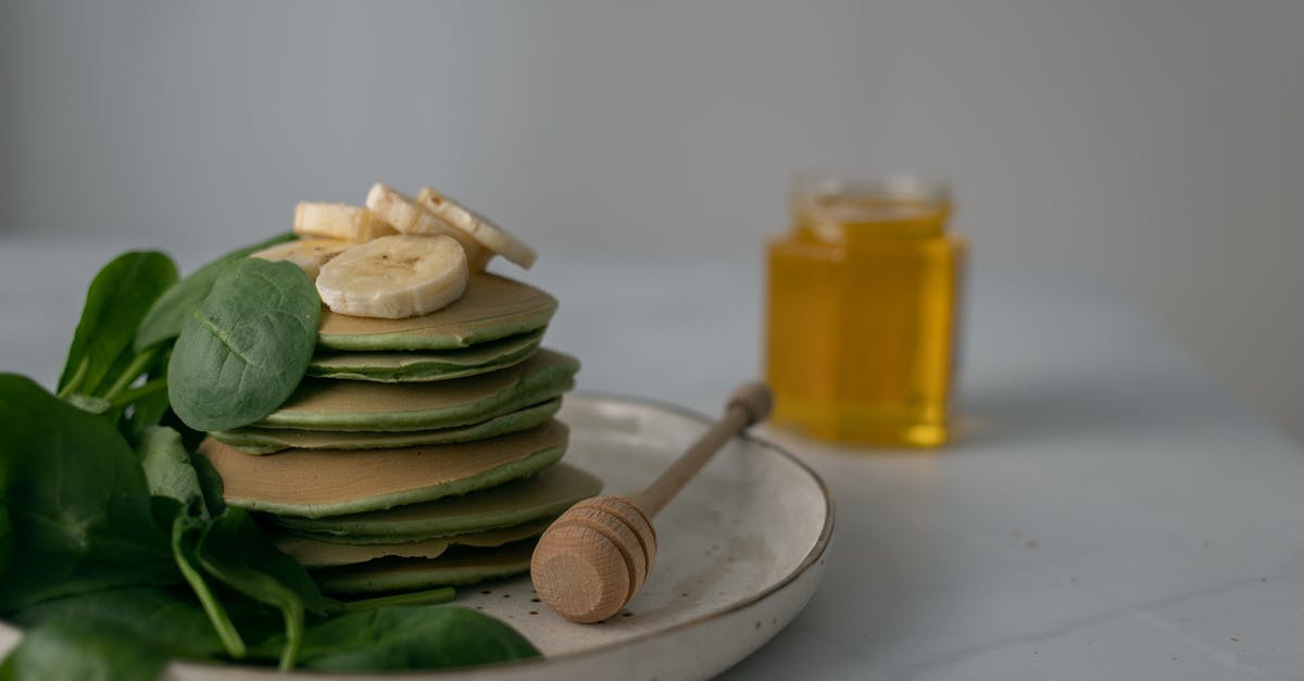 Why are there unreachable bananas? - Photo of a Stack of Pancakes Beside a Honey Dipper