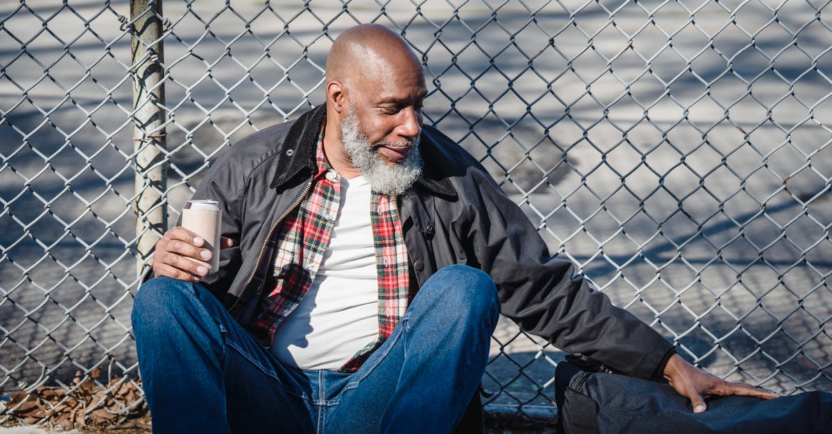 Why can't I chain fairs with ROB like in brawl - Hairless aged ethnic male in casual outfit touching bag while sitting against mesh fence with beer can