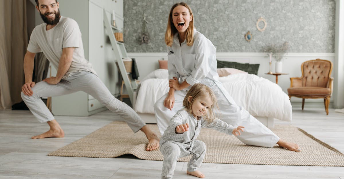 Why can't I spend time in bed? - Woman in White Scrub Suit Sitting on Floor Beside Girl in White Dress