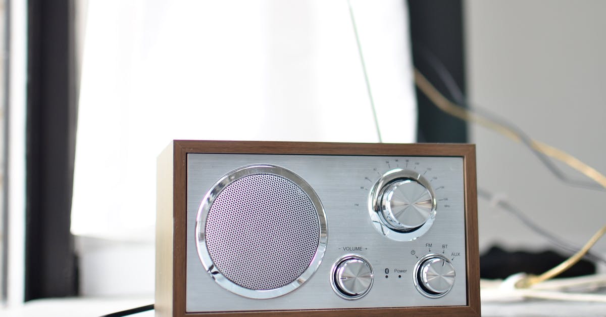 Why can't I tune the radio to the Poké Flute station? - Classic styled radio receiver with chrome buttons and speaker and wooden case placed on table in daylight