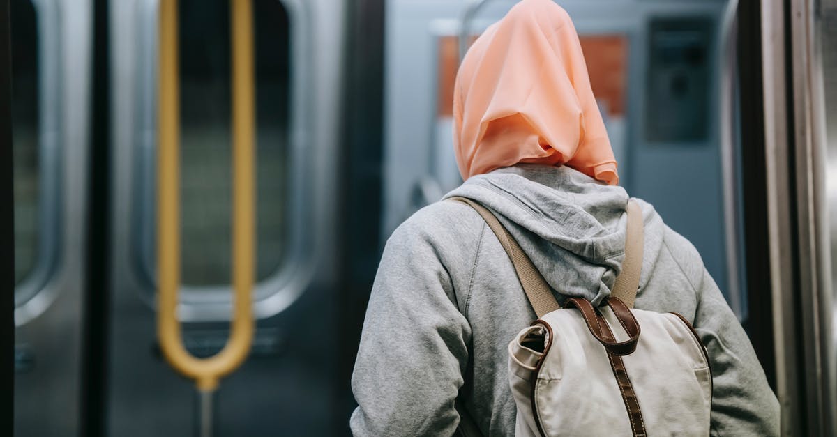 Why did my train choose the blocked path at the junction? - Woman with backpack in subway