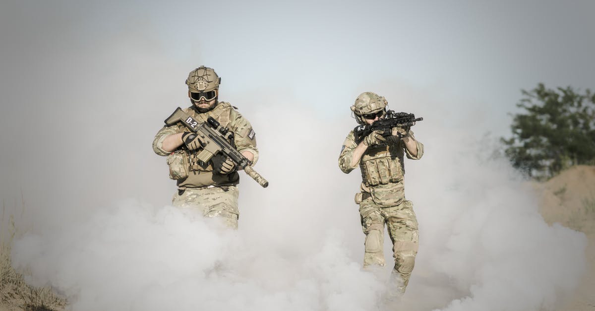 Why does a minor faction attack me once I assimilate it? - Men Holding Rifle While Walking Through Smoke Grenade Why does a minor faction attack me once I assimilate it? - Men Holding Rifle While Walking Through Smoke Grenade