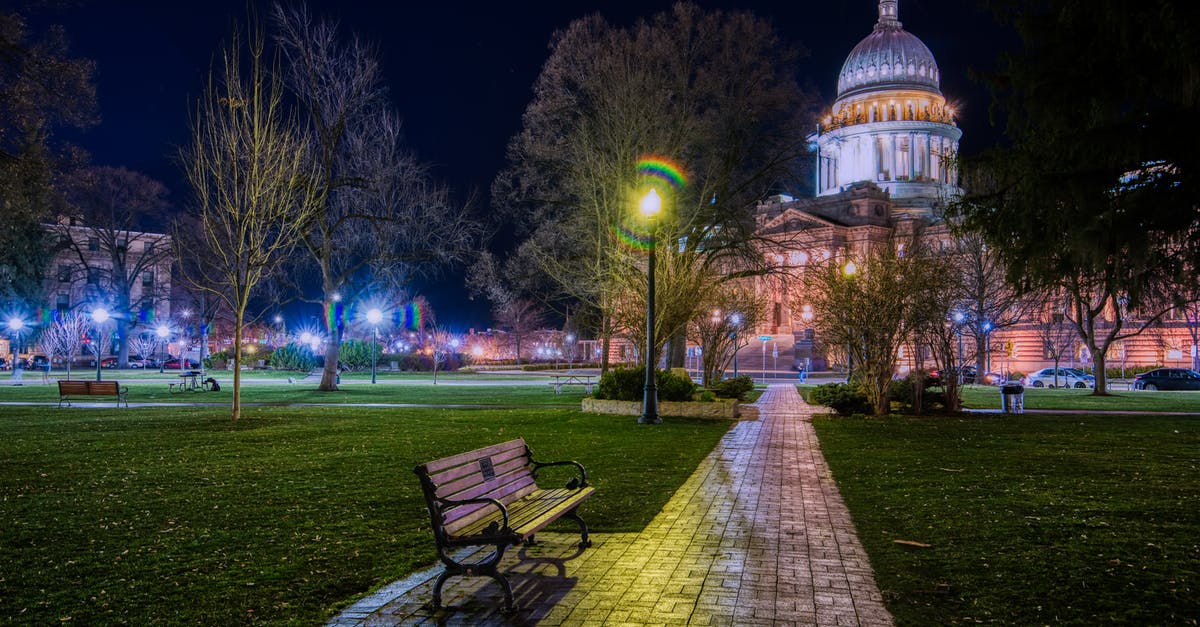 Why does Isaac glow on spiderwebs? - Cold park with benches against cathedral at night