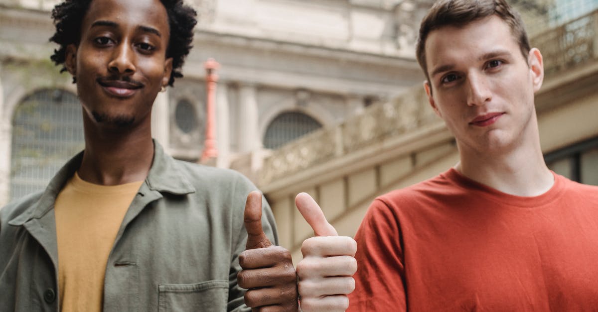 Why does this Wizard build recommend Physical/Lightning Resistance? - Positive young multiracial guys demonstrating thumbs up sign at camera