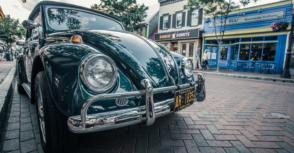 Why does +xp shows when upgrading unit? - Green Volkswagen Beetle Parked on Sidwalk