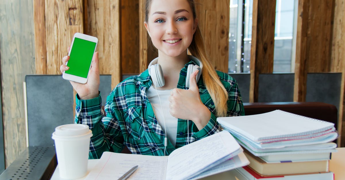 Why is my StarCraft folder 6.79GB? - Smiling Woman Holding White Android Smartphone While Sitting Front of Table