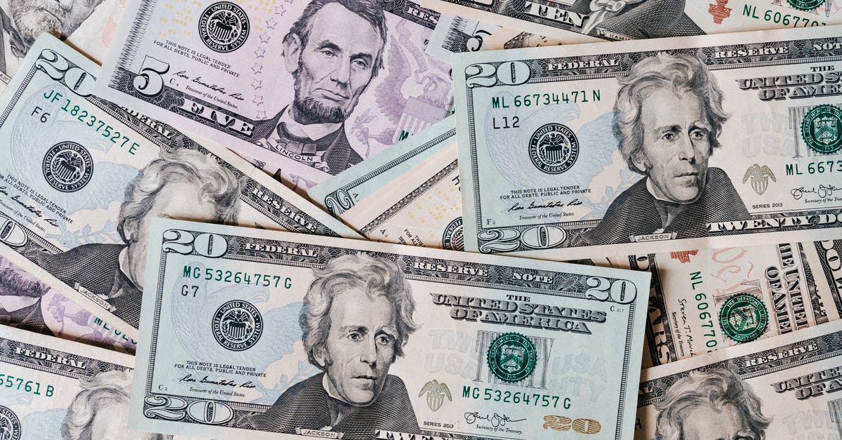 Why is sum of shares different from total value (10% instead of 100%)? - Top view of different types and colors American dollars placed together on each other Why is sum of shares different from total value (10% instead of 100%)? - Top view of different types and colors American dollars placed together on each other