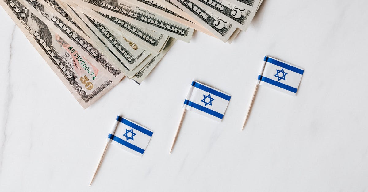 Why is sum of shares different from total value (10% instead of 100%)? - Top view of bundle of different nominal pars dollars and Israeli flags on toothpicks placed on white surface of marble table Why is sum of shares different from total value (10% instead of 100%)? - Top view of bundle of different nominal pars dollars and Israeli flags on toothpicks placed on white surface of marble table
