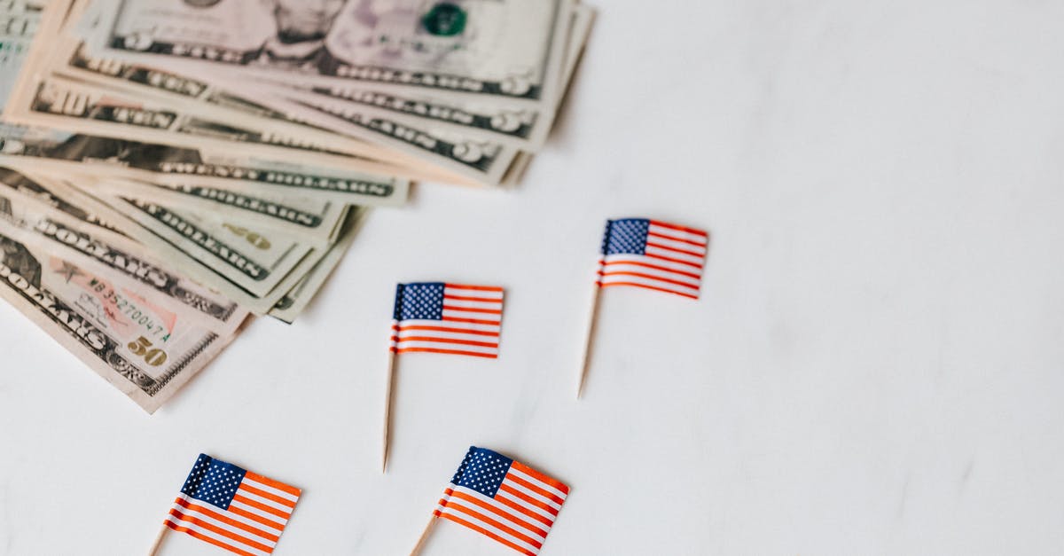 Why is sum of shares different from total value (10% instead of 100%)? - From above of flags of United States of America on toothpicks placed near bundle of American dollars of different nominal pars on white surface of table Why is sum of shares different from total value (10% instead of 100%)? - From above of flags of United States of America on toothpicks placed near bundle of American dollars of different nominal pars on white surface of table