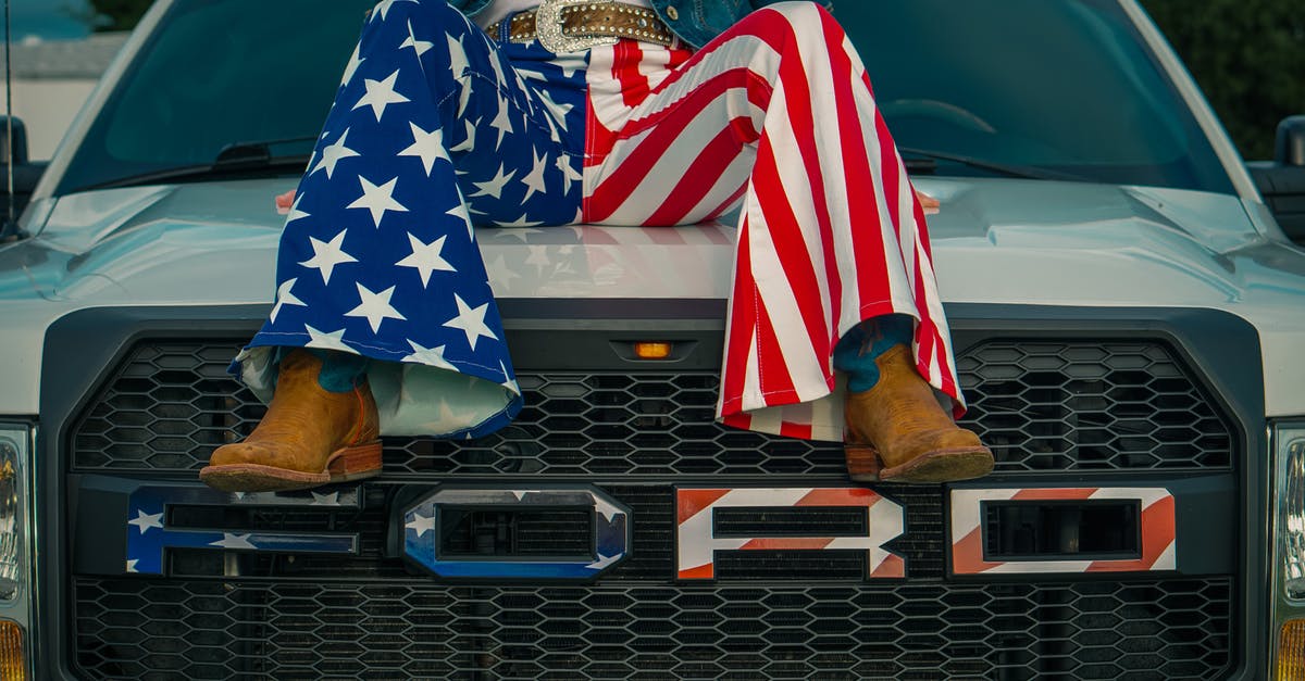 Why should I attack the leg of the dragon? - Legs of a Woman Wearing American Flag Pants Sitting on Top of a Car Hood