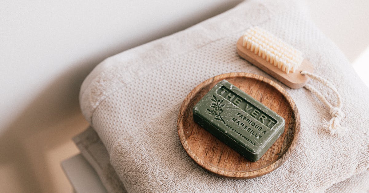 Why would I want to rub my friend's faces? - Natural soap and brush on folded towels