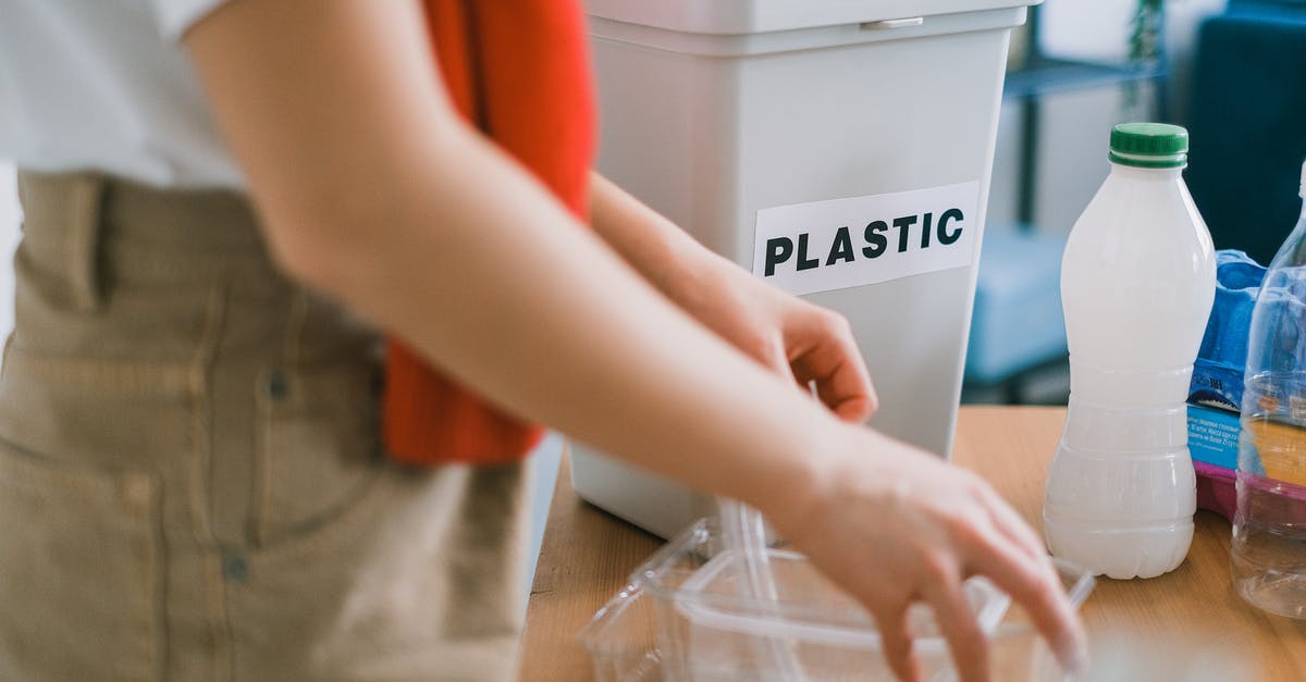 Will a pick last just as long if used under water? - Crop anonymous female in casual clothes standing near bucket for plastic and sorting out rubbish in light room