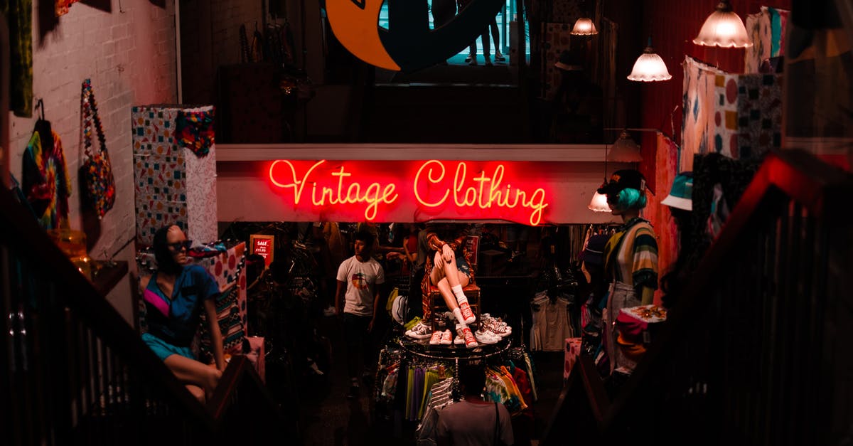 Will it agro the guards to cut down pig city trees? - Neon sign in shop with vintage clothes