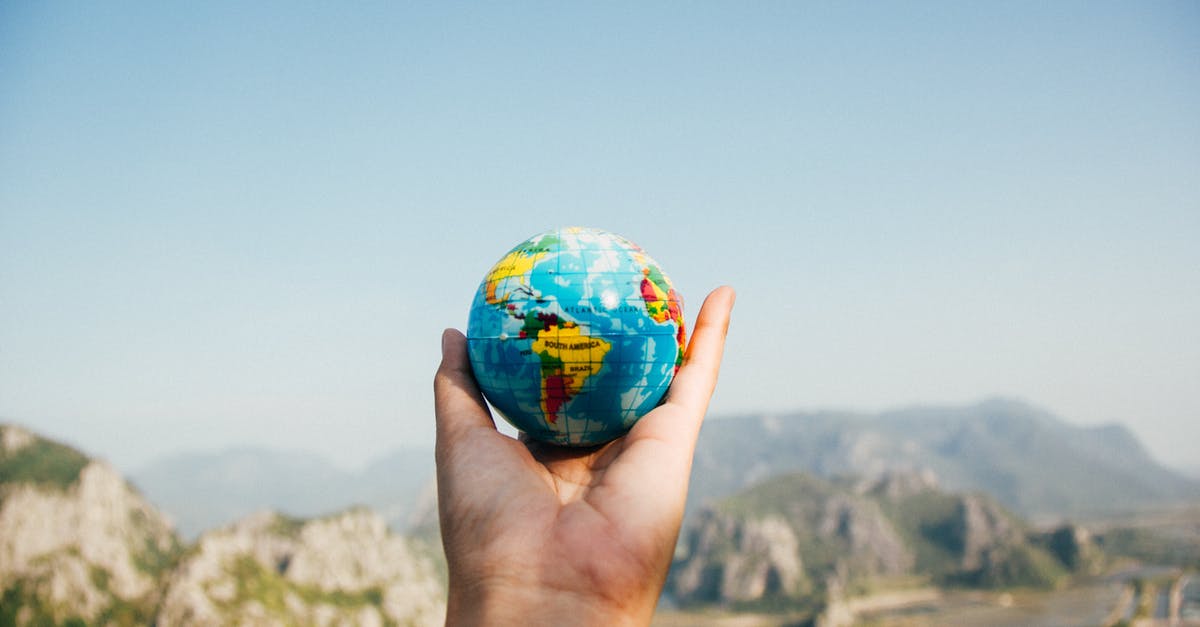 World of Trucks not synchronizing - Person Holding World Globe Facing Mountain