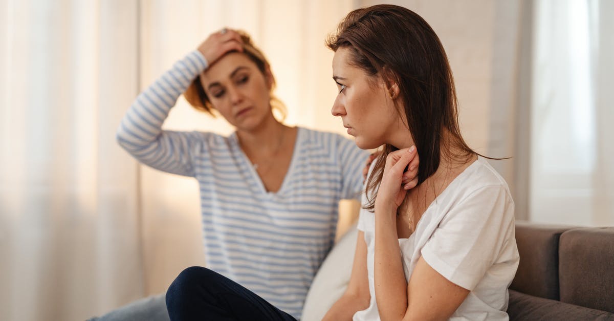 Worried about my sapling - Worried Woman Sitting on a Sofa 