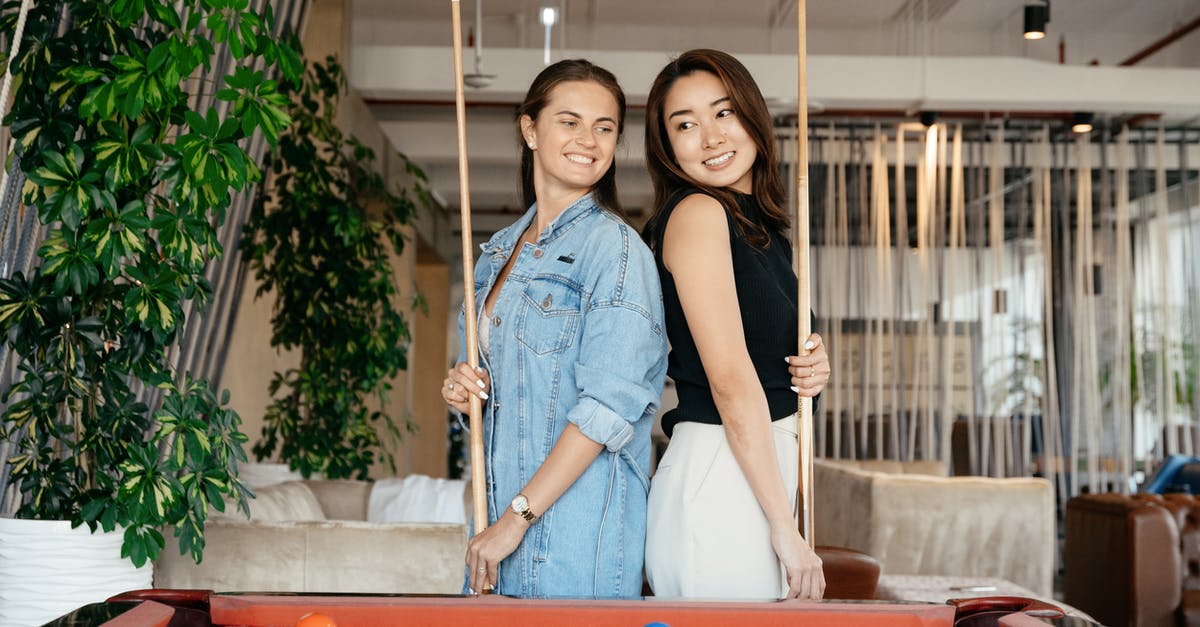 Y position for player to be considered inside radius of Lingering Potions? - Cheerful multiethnic friends in casual clothes standing with billiard cues while playing pool game in spacious room in daytime Y position for player to be considered inside radius of Lingering Potions? - Cheerful multiethnic friends in casual clothes standing with billiard cues while playing pool game in spacious room in daytime